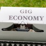 Gig Economy - A typewriter with the word gig economy written on it