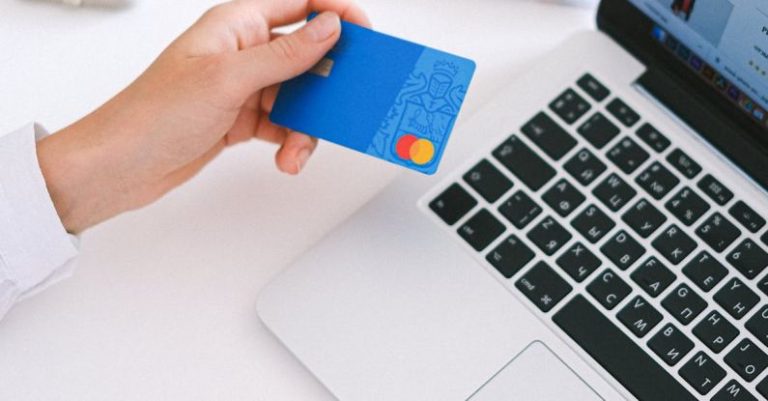 Ecommerce Shift - Person Holding Bank Card