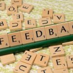 Feedback Loop - The word feedback is spelled out with scrabble tiles