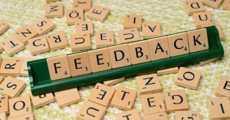 Feedback Loop - The word feedback is spelled out with scrabble tiles