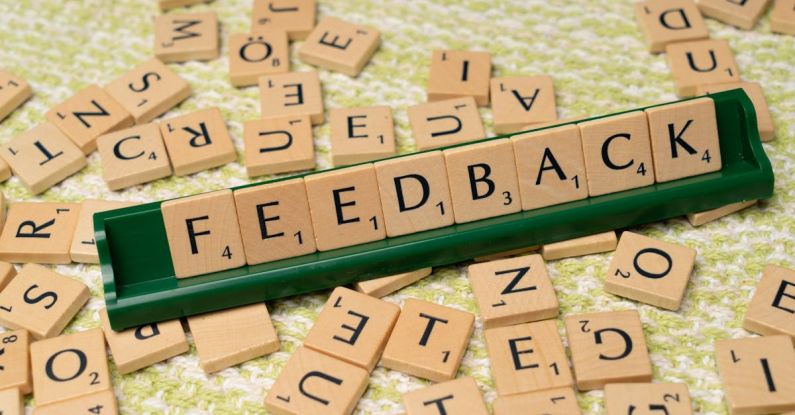 Feedback Loop - The word feedback is spelled out with scrabble tiles