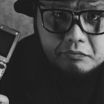 Brand Advancement - A Man Smirking with a Game Boy Advance