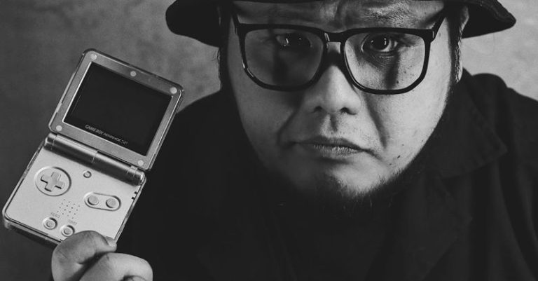 Brand Advancement - A Man Smirking with a Game Boy Advance