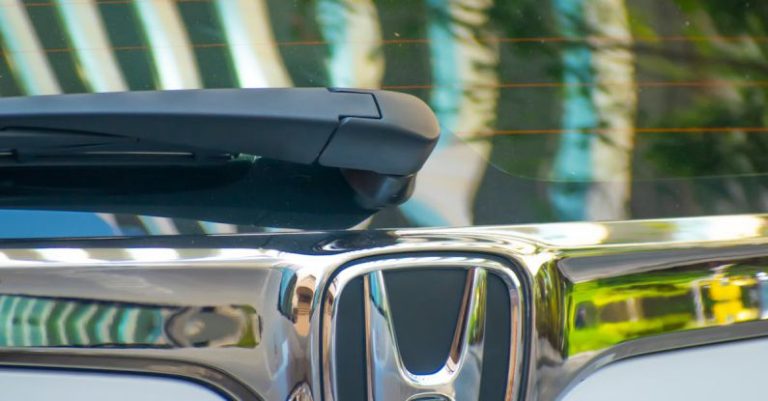 Brand Evaluation - The honda logo on the front of a car