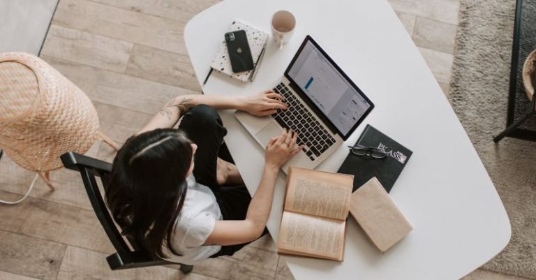Brand Job Search - Young lady typing on keyboard of laptop in living room