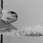Challenges Overcome - Person Swimming at the Pool in Grayscale Photo