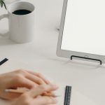 Freelancing Networking - Person Writing on White Paper on White Table