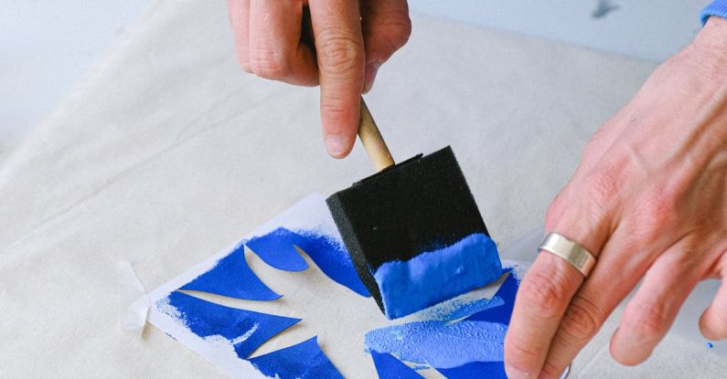 Skills Transfer - Crop man transferring sketch on bag