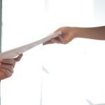 Resume Conversion - Job Applicant Passing Her Documents