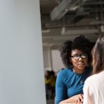 Job Interview - Woman Wearing Blue Top Beside Table