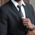 Professional Attire - Man Wearing Black Notched Lapel Blazer
