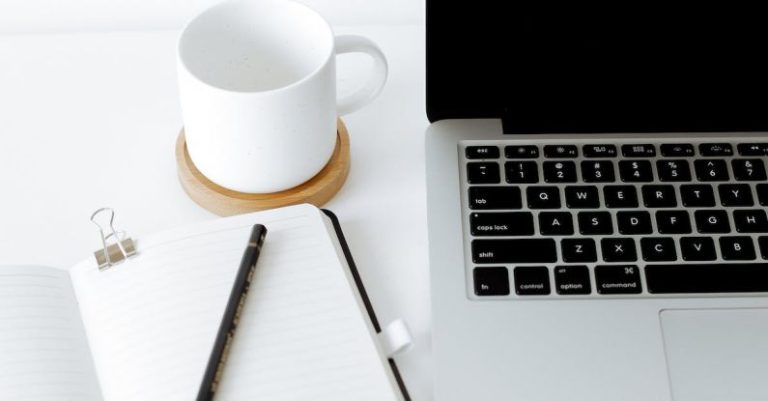 Alumni Network - Workplace with laptop and opened diary