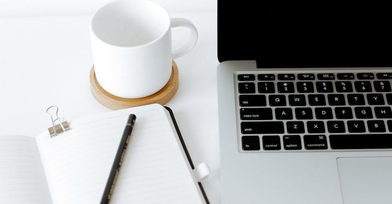 Alumni Network - Workplace with laptop and opened diary