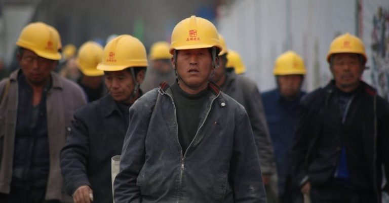 Industry Leader - Group of Persons Wearing Yellow Safety Helmet during Daytime
