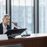 Professional Association - Professional Person talking on Microphone