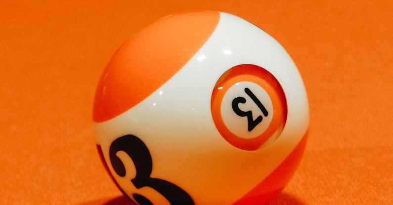 Learning Combination - Billiard ball with number on bright orange surface for complex intellectual board game
